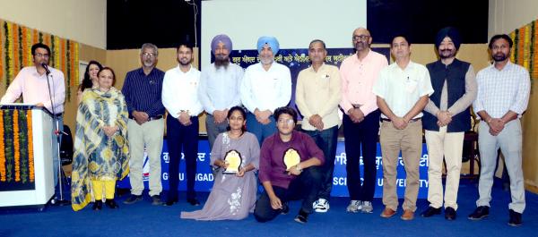 participants with their winning trophies