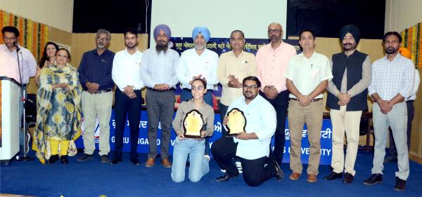 participants with their winning trophies